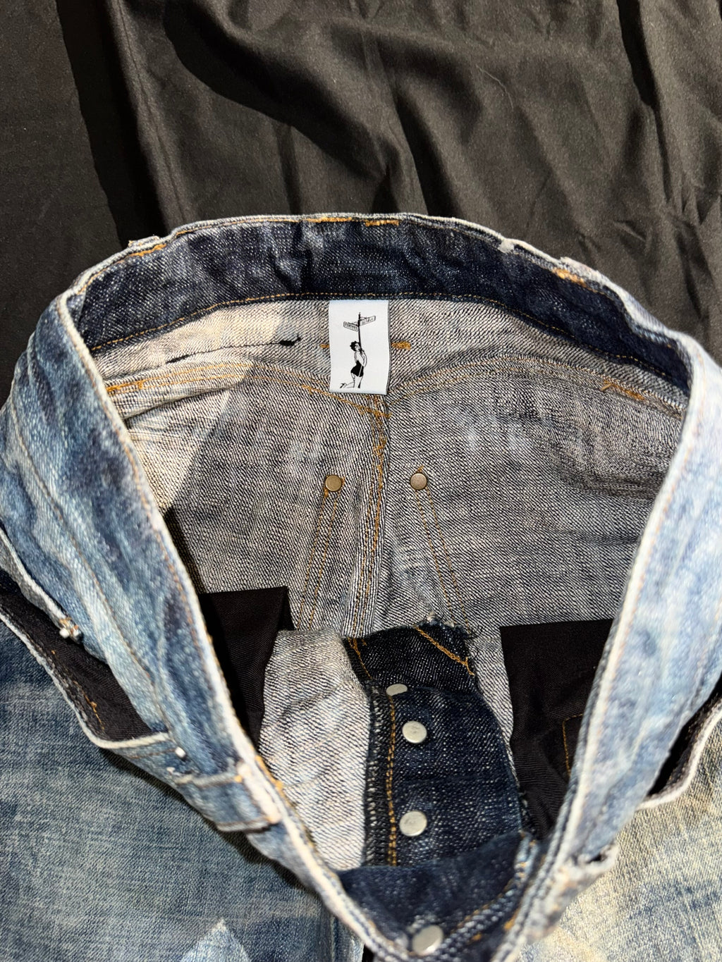“coated” washed bootcuts
